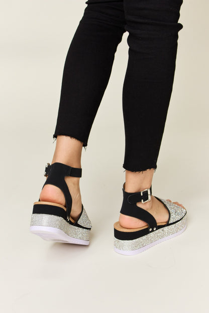 Glimmer Glow Wedge Sandals