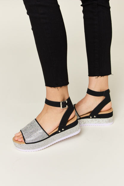 Glimmer Glow Wedge Sandals